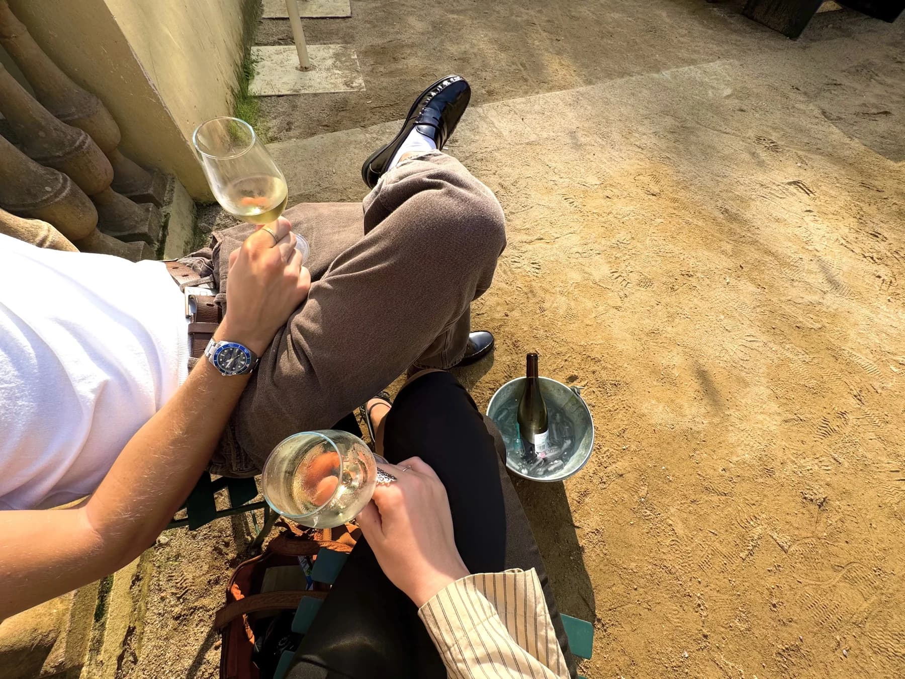 Two glasses of white wine enjoyed in the sunshine at La Font del Gat