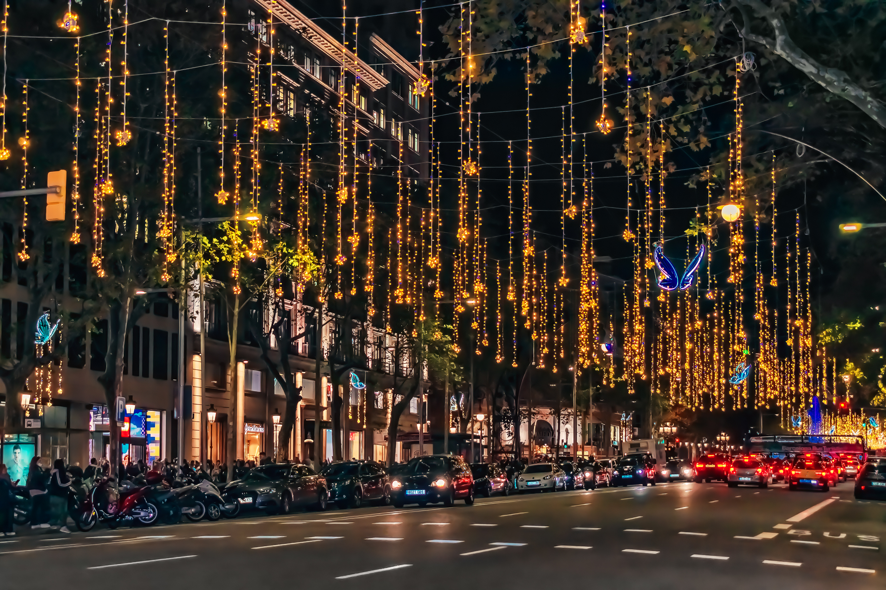 Christmas lights illuminating a Barcelona street at night